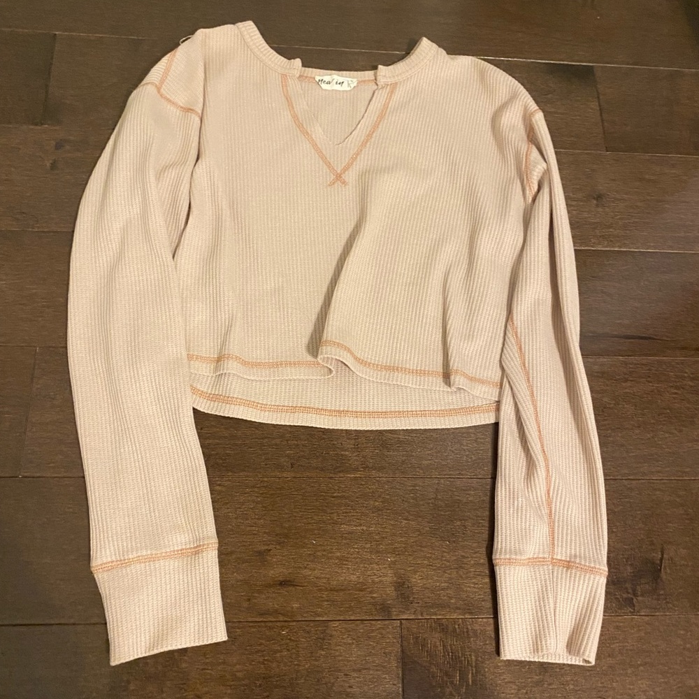 Beige cropped sweater from a small boutique